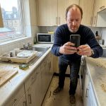 A London landlord takes a picture for his inventory check-up report
